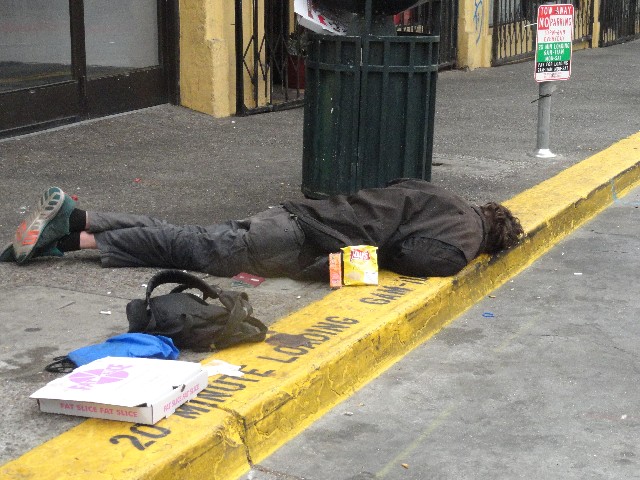 Homeless man Berkeley California with food from homeless outreach charity