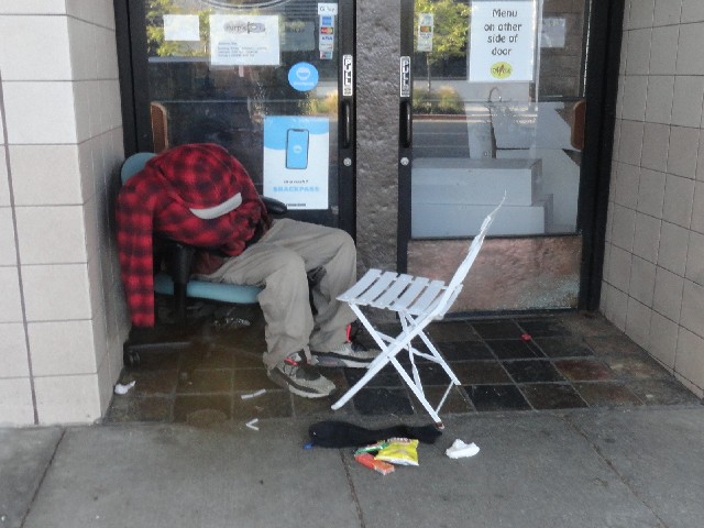 Homeless outreach charity Berkeley California give food to homeless people living on the streets