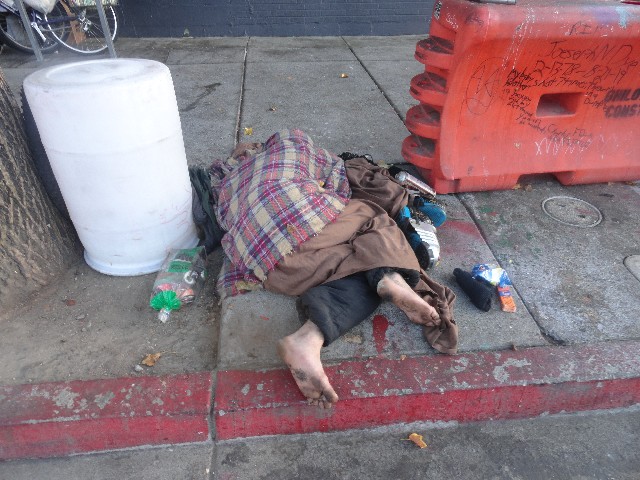 Potato Chips and Peanut Butter Cheese Crackers and socks by homeless person in Berkeley CA